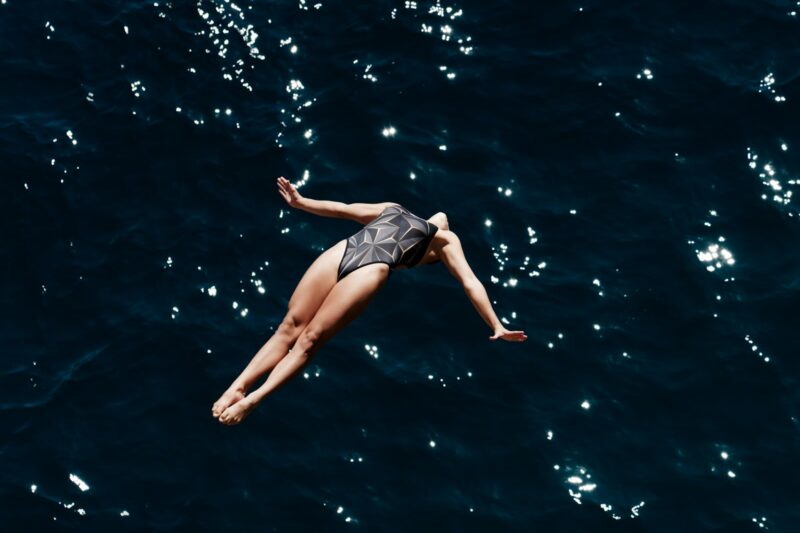 A woman floating in the ocean on her back