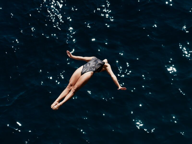 A woman floating in the ocean on her back